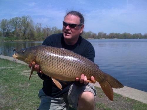 16_10618767-tournament-director-david-moore-and-his-central-ny-common-carp_0.jpg