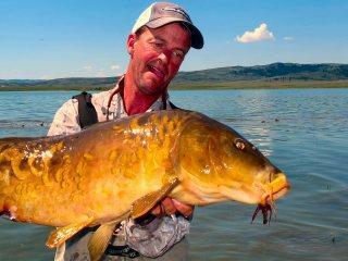 blog_July_29_2012_13+Jeff+Currier+with+nice+mirror+carp.jpg