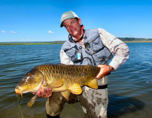 jeff-currier-with-mirror-carp.jpg