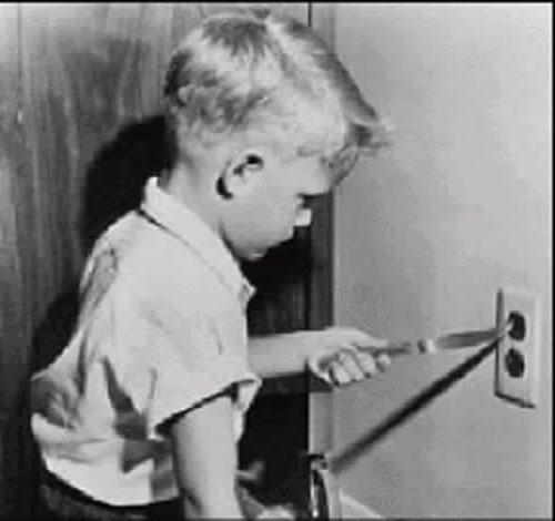 boy-sticking-knife-into-socket.jpg